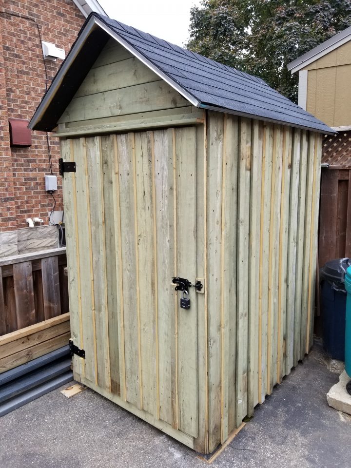 Reclaimed wood snowblower shed